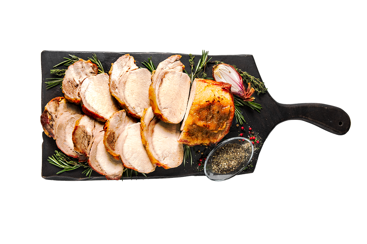 Slices of cooked pork prepared on a black cutting board