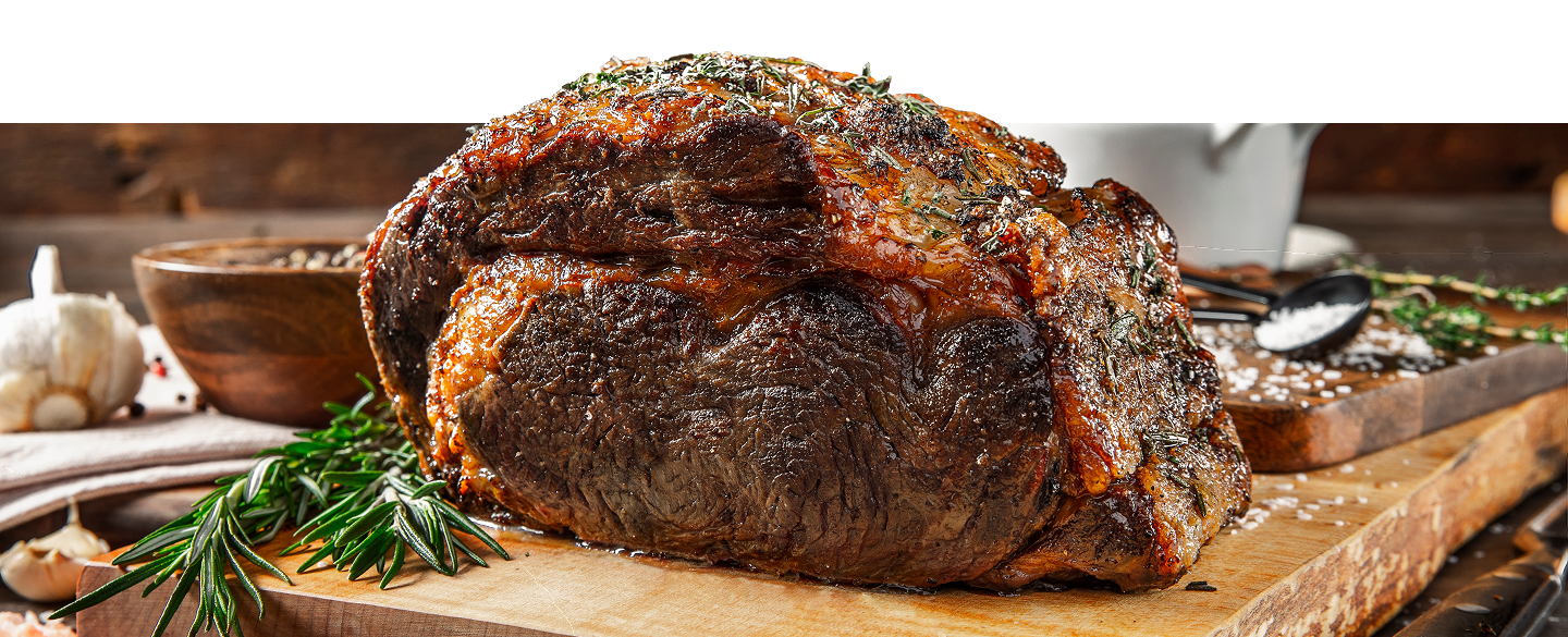 Prime Rib Roast garnished on a cutting board