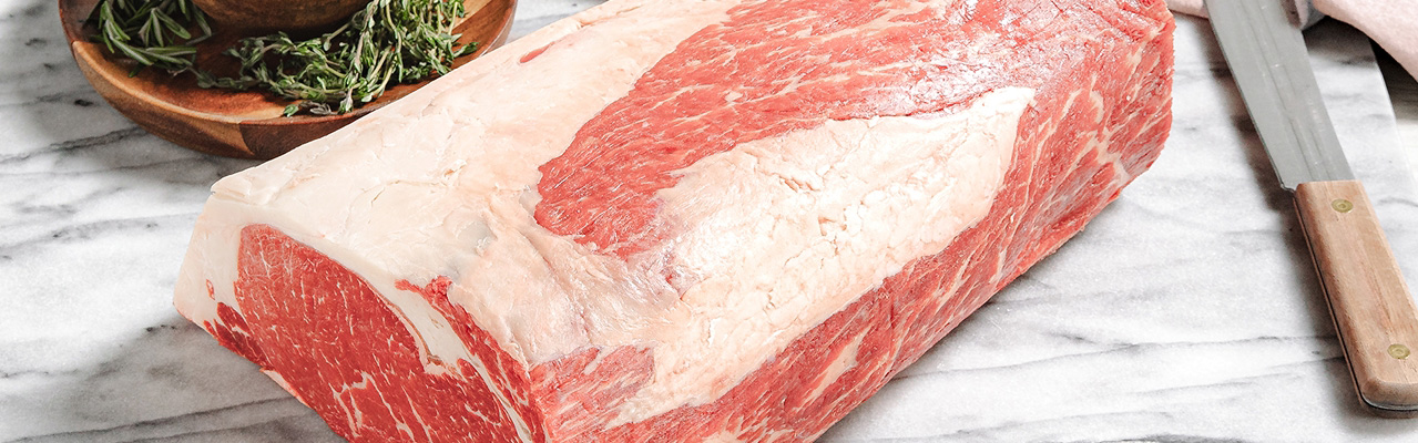 Private label meat on a marble cutting board